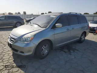 2006 Honda Odyssey EX-L with VIN 5FNRL38796B084735, listed as a Copart auction lot 59743705 with 137,974 mi miles and Salvage title. Bid and sale history available at DreamBid. Image 1.