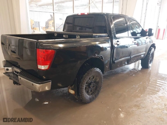 2007 Nissan Titan LE with VIN 1N6BA07B77N242856, listed as a IAAI auction lot 41496692 with 243,803 mi miles. Bid and sale history available at carsss.com. Image 4.