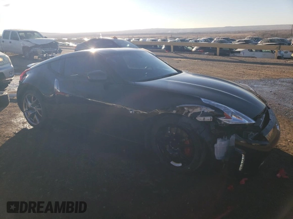 2014 Nissan 370Z Nismo z VIN JN1AZ4EHXEM632166, wystawiony jako Copart lot #88311915 z przebiegiem 18 414 mil mil oraz Szkoda całkowita • Salvage title. Historia ofert i sprzedaży dostępna na DreamBid. Obrazek 4.