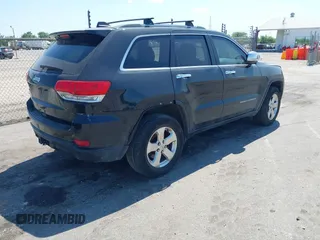 2014 Jeep Grand Cherokee Laredo with VIN 1C4RJEAG9EC157383, listed as a IAAI auction lot 42074411 with 213,566 mi miles and . Bid and sale history available at DreamBid. Image 4.