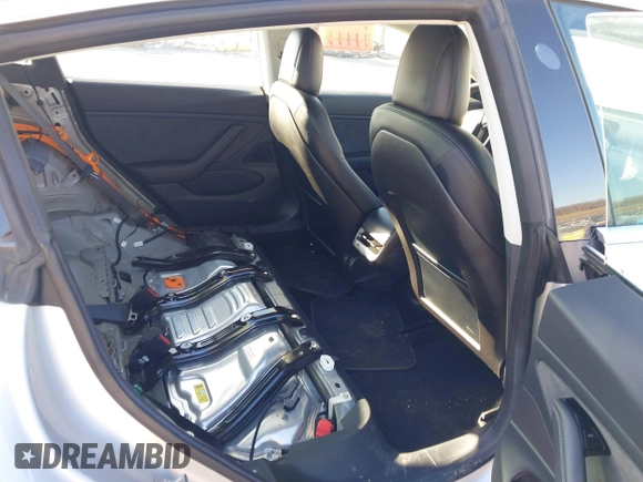 2018 Tesla Model 3 Long Range Battery with VIN 5YJ3E1EB9JF065057, listed as a IAAI auction lot 41863903 with 54,584 mi miles and . Bid and sale history available at DreamBid. Image 8.