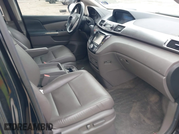 2014 Honda Odyssey Touring with VIN 5FNRL5H9XEB045695, listed as a IAAI auction lot 41545348 with 131,472 mi miles and . Bid and sale history available at carsss.com. Image 5.