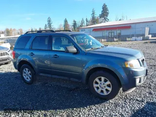 2010 Mazda Tribute Touring with VIN 4F2CY9C73AKM04595, listed as a IAAI auction lot 40797681 with 122,774 mi miles. Bid and sale history available at carsss.com. Image 13.