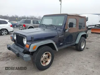 1998 Jeep Wrangler SE with VIN 1J4FY29P9WP792089, listed as a IAAI auction lot 41794793 with 200,838 mi miles. Bid and sale history available at carsss.com. Image 2.