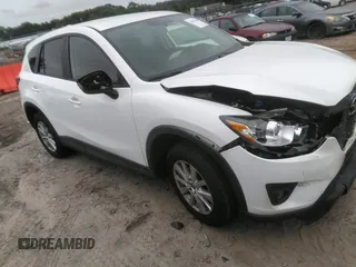 2014 Mazda CX-5 Touring z VIN JM3KE4CY0E0303748, wystawiony jako IAAI lot #42127406 z przebiegiem Nie podano mil oraz . Historia ofert i sprzedaży dostępna na DreamBid. Obrazek 1.