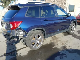 2020 Honda Passport Touring with VIN 5FNYF7H90LB004665, listed as a IAAI auction lot 41669821 with 59,768 mi miles and . Bid and sale history available at DreamBid. Image 4.