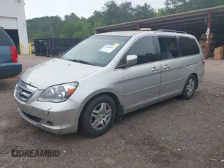 2007 Honda Odyssey EX with VIN 5FNRL384X7B036281, listed as a IAAI auction lot 42058864 with 240,791 mi miles. Bid and sale history available at carsss.com. Image 2.