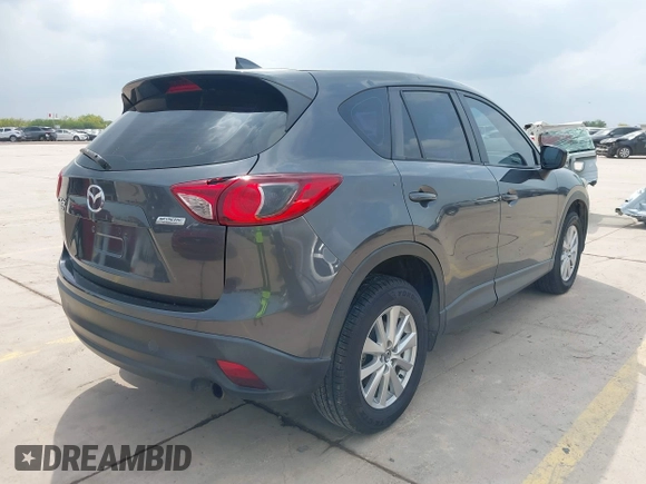 2016 Mazda CX-5 Sport with VIN JM3KE4BY8G0921243, listed as a IAAI auction lot 42102663 with 111,960 mi miles and . Bid and sale history available at DreamBid. Image 4.