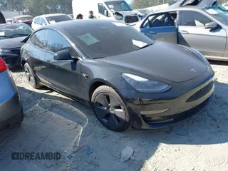 2022 Tesla Model 3 with VIN 5YJ3E1EAXNF305410, listed as a IAAI auction lot 41649360 with 56,189 mi miles. Bid and sale history available at carsss.com. Image 1.