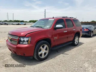 2012 Chevrolet Tahoe LS with VIN 1GNSCAE01CR227459, listed as a Copart auction lot 56353955 with 201,836 mi miles and Salvage title. Bid and sale history available at DreamBid. Image 1.