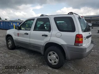2001 Ford Escape XLS with VIN 1FMYU02161KB01283, listed as a Copart auction lot 59145105 with 86,195 mi miles and Salvage title. Bid and sale history available at DreamBid. Image 2.