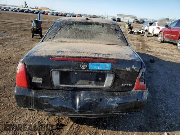 2004 Cadillac DeVille DTS z VIN 1G6KF57944U253624, wystawiony jako Copart lot #49444905 z przebiegiem 174 823 mil mil oraz Szkoda całkowita • Salvage title. Historia ofert i sprzedaży dostępna na DreamBid. Obrazek 6.