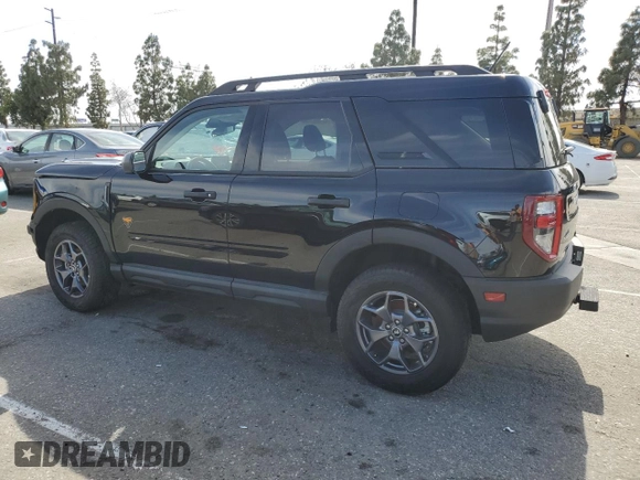 2023 Ford Bronco Sport Badlands z VIN 3FMCR9D97PRD35830, wystawiony jako Copart lot #56950865 z przebiegiem 7 401 mil mil oraz Szkoda całkowita • Salvage title. Historia ofert i sprzedaży dostępna na DreamBid. Obrazek 2.