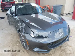2022 Mazda MX-5 Miata Grand Touring z VIN JM1NDAD75N0502727, wystawiony jako IAAI lot #42171580 z przebiegiem 23 505 mil mil oraz . Historia ofert i sprzedaży dostępna na DreamBid. Obrazek 1.