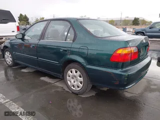 1999 Honda Civic VP with VIN 2HGEJ6618XH579736, listed as a IAAI auction lot 41912296 with 268,631 mi miles. Bid and sale history available at carsss.com. Image 3.