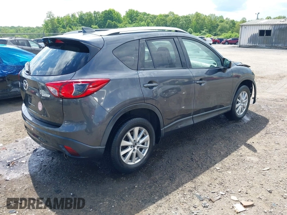 2015 Mazda CX-5 Touring with VIN JM3KE4CY9F0506879, listed as a IAAI auction lot 42209768 with 87,690 mi miles and . Bid and sale history available at DreamBid. Image 4.