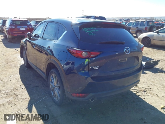 2019 Mazda CX-5 Grand Touring with VIN JM3KFBDM2K1685168, listed as a IAAI auction lot 41323598 with 88,429 mi miles. Bid and sale history available at carsss.com. Image 3.