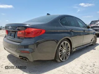 2019 BMW 5 Series M550i xDrive with VIN WBAJB9C51KB287797, listed as a Copart auction lot 65382465 with 61,459 mi miles and Salvage title. Bid and sale history available at DreamBid. Image 3.