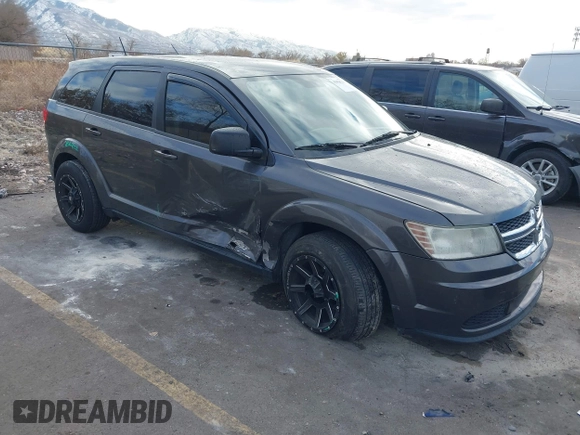 2014 Dodge Journey American Value Pkg with VIN 3C4PDCAB5ET235427, listed as a IAAI auction lot 41056216 with 164,740 mi miles. Bid and sale history available at carsss.com. Image 1.