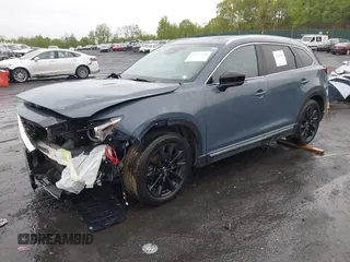 2021 Mazda CX-9 Grand Touring z VIN JM3TCBDY8M0528365, wystawiony jako IAAI lot #42222394 z przebiegiem 44 850 mil mil oraz . Historia ofert i sprzedaży dostępna na DreamBid. Obrazek 2.