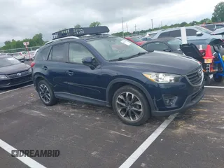 2016 Mazda CX-5 Grand Touring with VIN JM3KE2DYXG0890174, listed as a IAAI auction lot 42157884 with 141,873 mi miles. Bid and sale history available at carsss.com. Image 13.