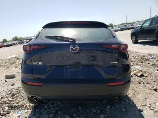 2023 Mazda CX-30 S with VIN 3MVDMBAM7PM520298, listed as a Copart auction lot 52251295 with 19,196 mi miles and Salvage Title. Bid and sale history available at carsss.com. Image 6.