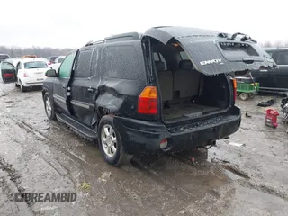2005 GMC Envoy XL SLE with VIN 1GKET16S156160473, listed as a IAAI auction lot 41510661 with 233,942 mi miles. Bid and sale history available at carsss.com. Image 3.