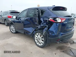 2013 Mazda CX-5 Grand Touring with VIN JM3KE2DE3D0168529, listed as a IAAI auction lot 41884766 with 173,558 mi miles. Bid and sale history available at carsss.com. Image 3.