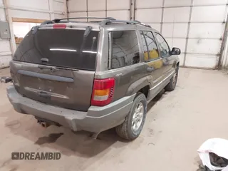2000 Jeep Grand Cherokee Laredo z VIN 1J4GW48S1YC277710, wystawiony jako IAAI lot #42033564 z przebiegiem Nie podano mil oraz . Historia ofert i sprzedaży dostępna na DreamBid. Obrazek 4.