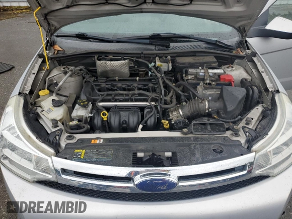 2008 Ford Focus SE z VIN 1FAHP33NX8W147139, wystawiony jako Copart lot #57520415 z przebiegiem 151 852 mil mil oraz Szkoda całkowita • Salvage title. Historia ofert i sprzedaży dostępna na DreamBid. Obrazek 11.