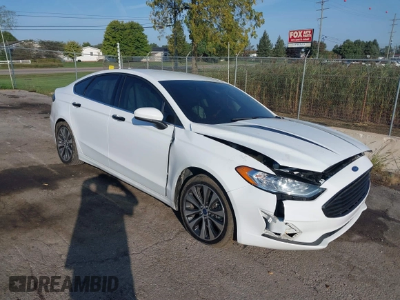 2020 Ford Fusion SE z VIN 3FA6P0T93LR247572, wystawiony jako IAAI lot #40481880 z przebiegiem 59 141 mil mil oraz . Historia ofert i sprzedaży dostępna na DreamBid. Obrazek 1.
