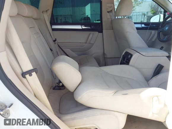 2012 Volkswagen Touareg Sport with VIN WVGEF9BP5CD007294, listed as a IAAI auction lot 41841268 with 160,883 mi miles and . Bid and sale history available at DreamBid. Image 8.