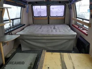 1995 GMC Vandura z VIN 1GDEG25KXSF550311, wystawiony jako Copart lot #78730594 z przebiegiem 149 663 mil mil oraz Szkody całkowita. Historia ofert i sprzedaży dostępna na DreamBid. Obrazek 10.