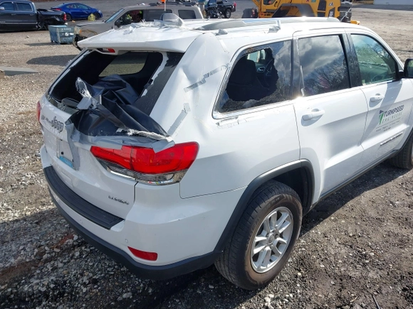 2018 Jeep Grand Cherokee Laredo E with VIN 1C4RJFAG8JC424609, listed as a IAAI auction lot 41124689 with 101,643 mi miles. Bid and sale history available at carsss.com. Image 12.