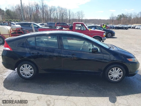2010 Honda Insight LX with VIN JHMZE2H53AS031218, listed as a IAAI auction lot 41738562 with 96808 miles. Bid and sale history available at carsss.com. Image 12.