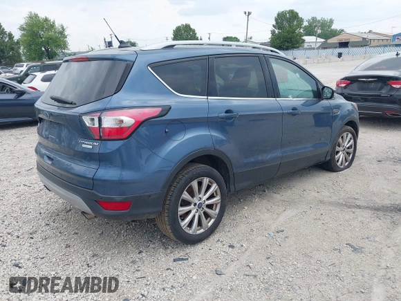 2018 Ford Escape Titanium z VIN 1FMCU0J91JUC00941, wystawiony jako IAAI lot #42679897 z przebiegiem 110 884 mil mil oraz . Historia ofert i sprzedaży dostępna na DreamBid. Obrazek 4.