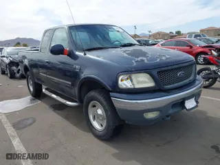 2000 Ford F-150 XL with VIN 1FTRX18L2YKA10388, listed as a IAAI auction lot 41526430 with 144,480 mi miles. Bid and sale history available at carsss.com. Image 1.