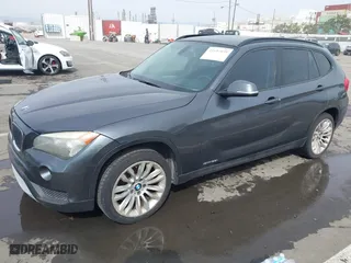2013 BMW X1 28i with VIN WBAVM1C55DVW41609, listed as a IAAI auction lot 41604038 with 126,036 mi miles. Bid and sale history available at carsss.com. Image 2.