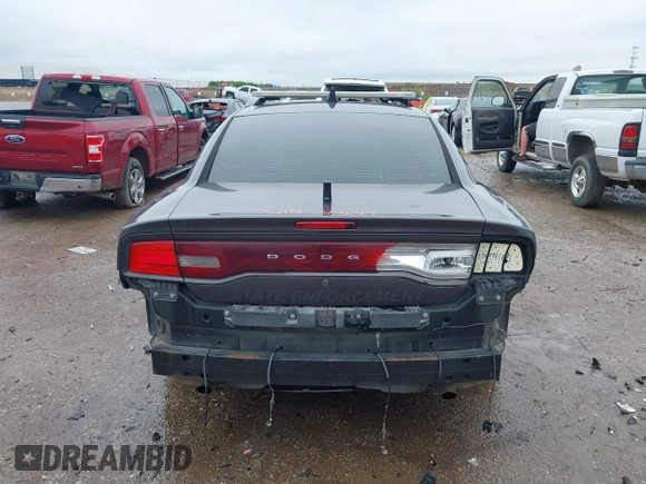 2013 Dodge Charger Police z VIN 2C3CDXAT4DH521778, wystawiony jako IAAI lot #42169438 z przebiegiem 191 907 mil mil oraz . Historia ofert i sprzedaży dostępna na DreamBid. Obrazek 16.