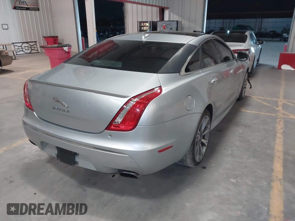 2015 Jaguar XJ with VIN SAJWA1CZ8F8V83873, listed as a IAAI auction lot 41271111 with 94,830 mi miles. Bid and sale history available at carsss.com. Image 4.