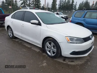 2012 Volkswagen Jetta TDI w/Premium with VIN 3VWLL7AJ6CM310950, listed as a IAAI auction lot 41714429 with 148,178 mi miles and . Bid and sale history available at DreamBid. Image 1.