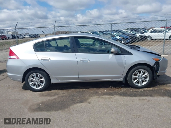 2010 Honda Insight EX with VIN JHMZE2H71AS017996, listed as a IAAI auction lot 42091356 with 142,474 mi miles and . Bid and sale history available at DreamBid. Image 13.