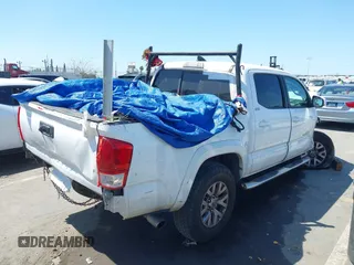 2016 Toyota Tacoma SR5 with VIN 5TFAX5GN8GX053836, listed as a IAAI auction lot 41973740 with 191,653 mi miles. Bid and sale history available at carsss.com. Image 4.