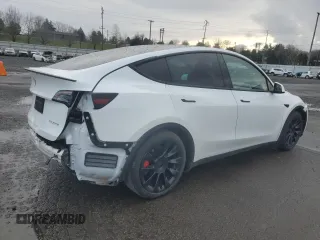 2022 Tesla Model Y Performance with VIN 7SAYGDEFXNF455517, listed as a Copart auction lot 44147905 with 32,210 mi miles and Salvage title. Bid and sale history available at DreamBid. Image 3.
