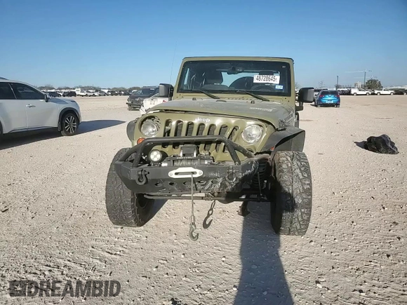 2013 Jeep Wrangler Rubicon z VIN 1C4HJWCG1DL574039, wystawiony jako Copart lot #48728645 z przebiegiem 116 537 mil mil oraz Szkoda całkowita • Salvage title. Historia ofert i sprzedaży dostępna na DreamBid. Obrazek 11.