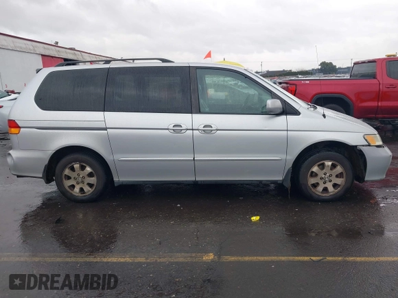 2004 Honda Odyssey EX-L with VIN 5FNRL18934B016420, listed as a IAAI auction lot 41473237 with 188,659 mi miles and . Bid and sale history available at DreamBid. Image 13.
