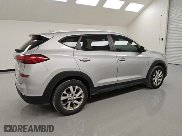 2021 Hyundai Tucson Value with VIN KM8J33A42MU392228, listed as a Copart auction lot 49471815 with 141,637 mi miles and Clean Title. Bid and sale history available at DreamBid. Image 3.