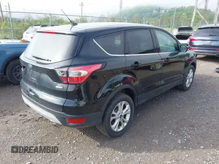 2017 Ford Escape SE with VIN 1FMCU9GD0HUC62616, listed as a IAAI auction lot 42194561 with 97,897 mi miles and . Bid and sale history available at DreamBid. Image 4.
