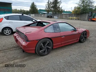 1987 Pontiac Fiero GT z VIN 1G2PG1199HP214795, wystawiony jako Copart lot #75901054 z przebiegiem 206 675 mil mil oraz Szkody całkowita. Historia ofert i sprzedaży dostępna na DreamBid. Obrazek 3.