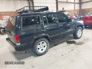 2001 Jeep Cherokee Sport z VIN 1J4FF58S11L562933, wystawiony jako IAAI lot #41944672 z przebiegiem 163 078 mil mil oraz . Historia ofert i sprzedaży dostępna na DreamBid. Obrazek 4.